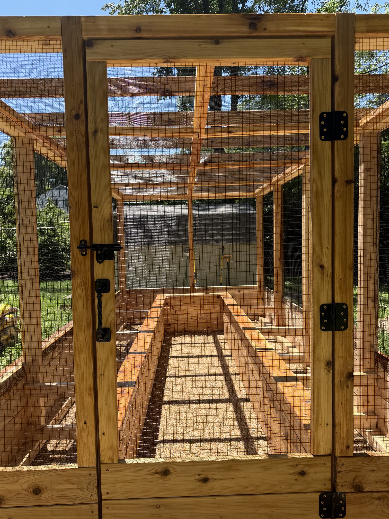 Detail of heavy-duty hardware cloth and cedar framing with steel hardware