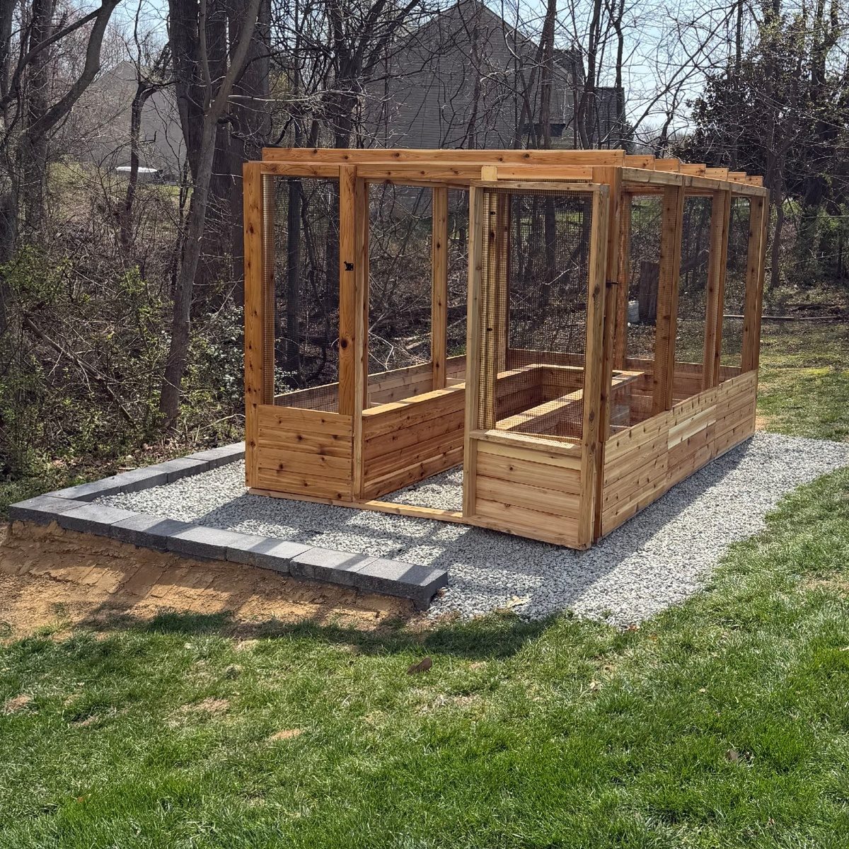 Fully enclosed Western Red Cedar garden system with walk-in door and raised beds