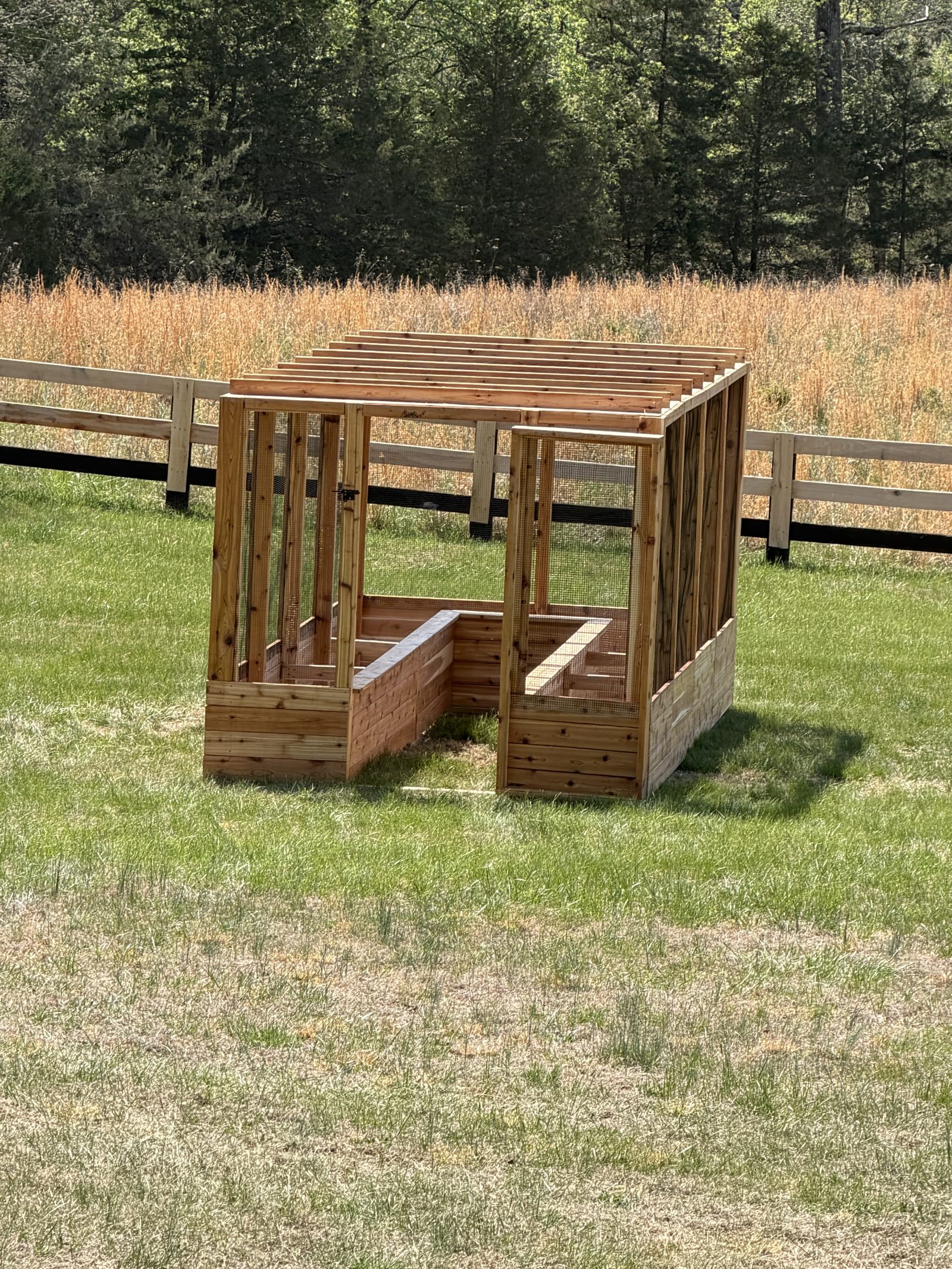 Enclosed cedar garden system in an open field setting